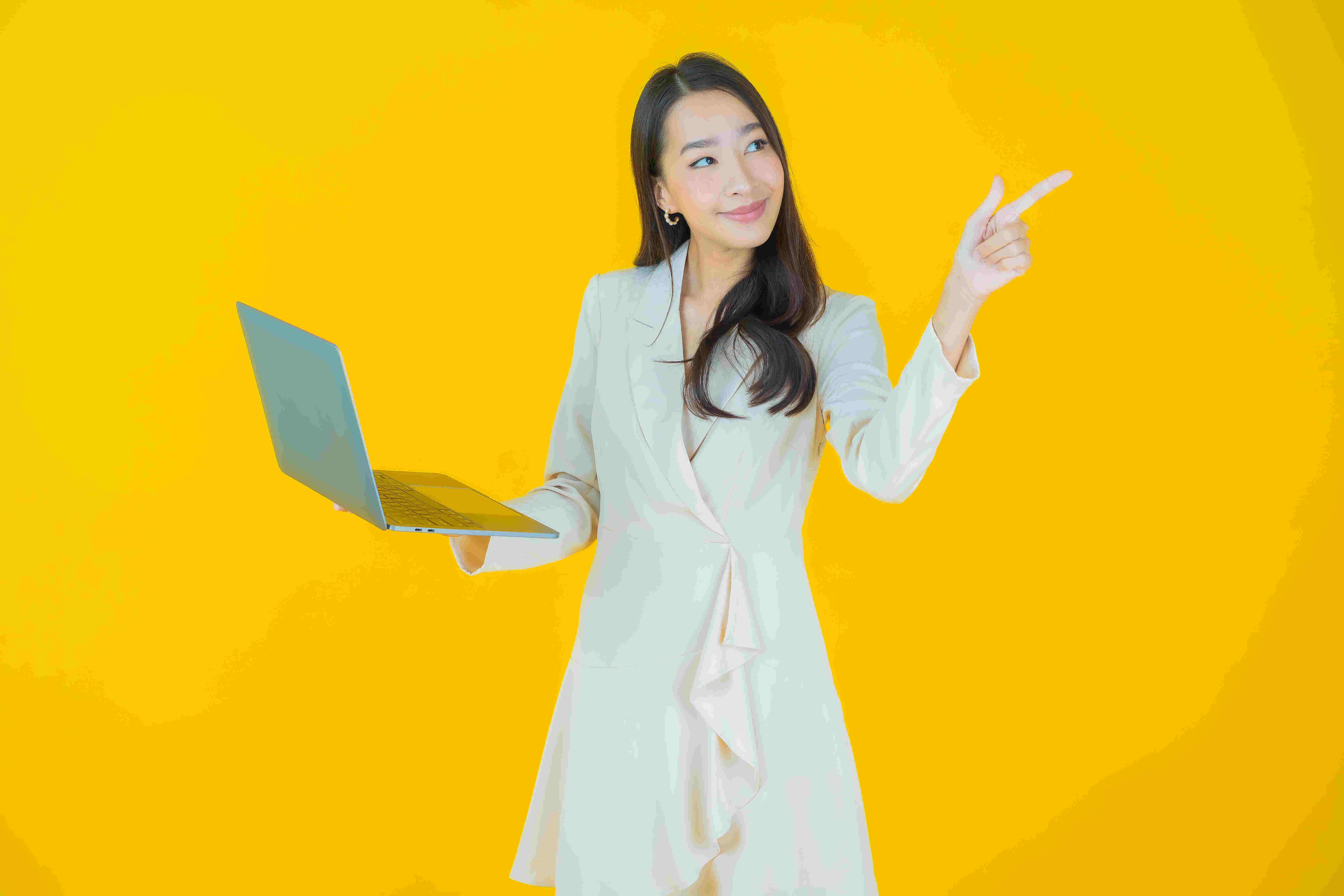 Portrait beautiful young asian woman smile with computer laptop on isolated background